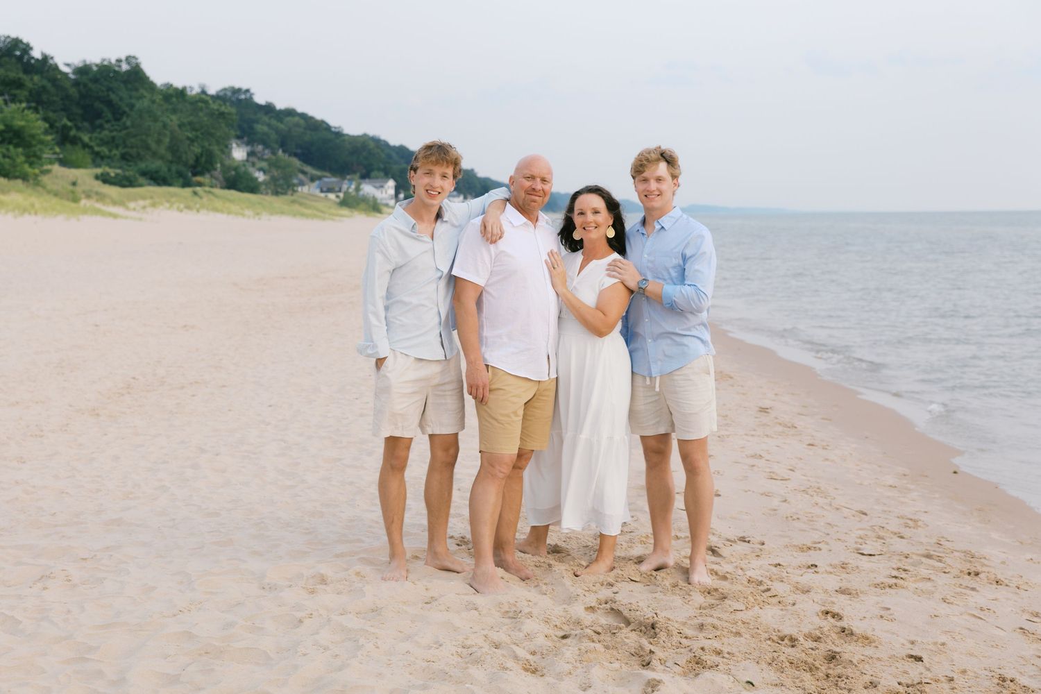 Grand Haven Summer Beach Family Pictures Lake Michigan. West Michigan Family Photographer Blue and white beach family outfit inspiration