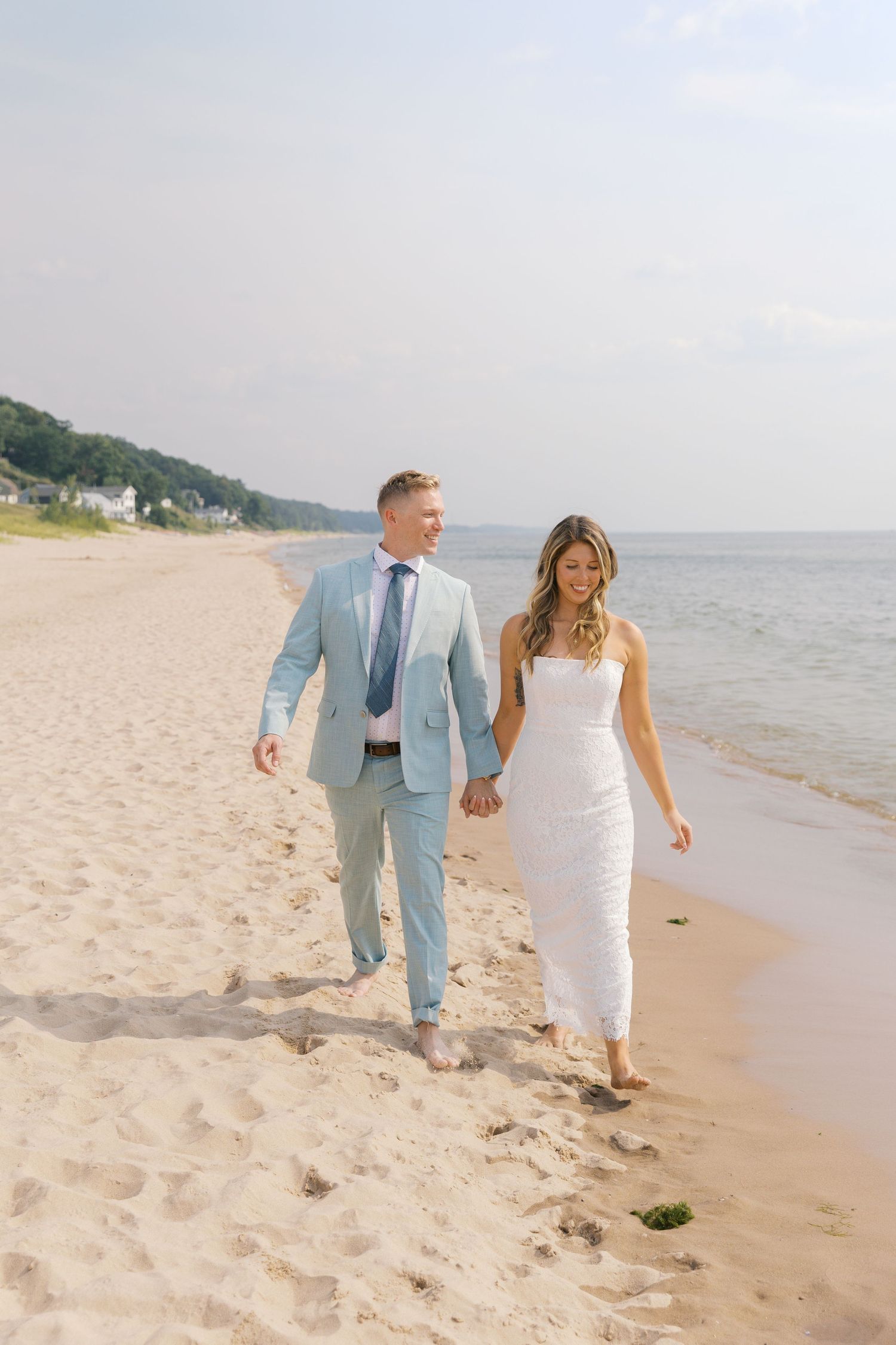 Grand Haven Michigan Elopement Photography at Grand Haven City Beach on Lake Michigan. Coastal summer elopement. From, Rayna Photography