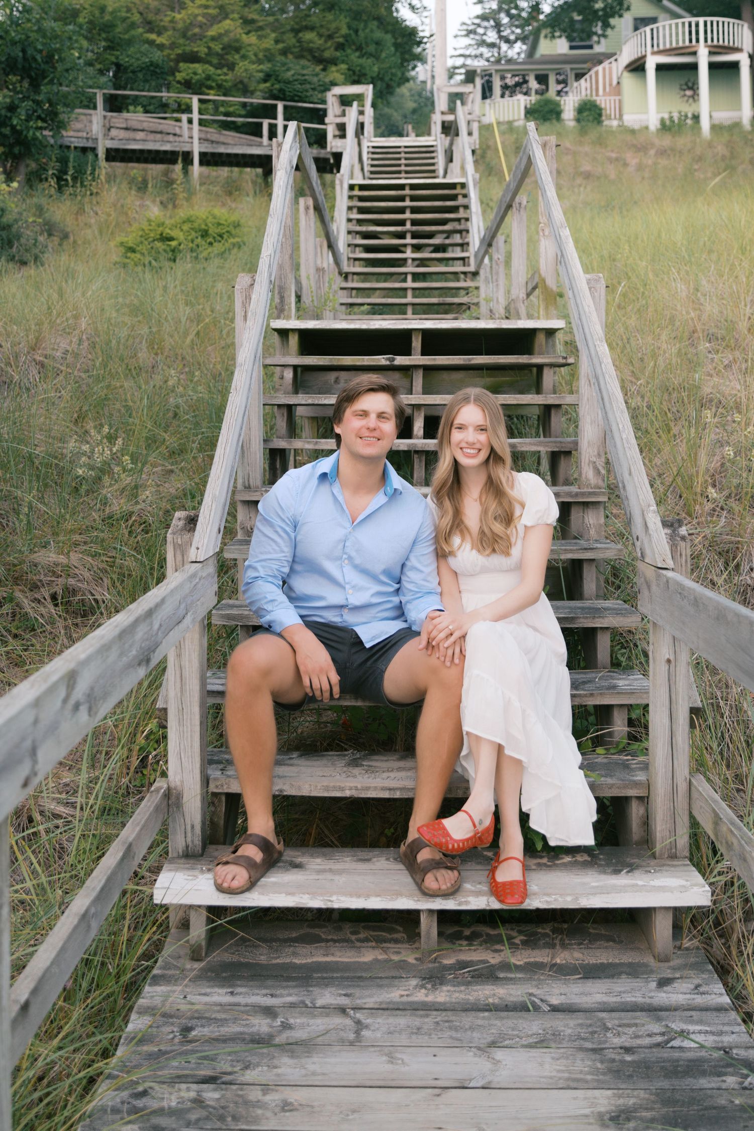 Grand Haven beach and boardwalk coastal midwest town on lake michigan engagement pictures during the summer Grand Haven Wedding photographer