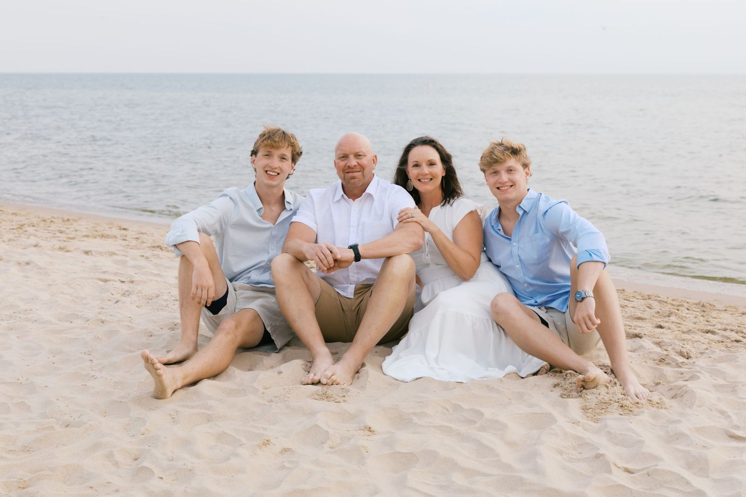 Grand Haven Summer Beach Family Pictures Lake Michigan. West Michigan Family Photographer Blue and white beach family outfit inspiration