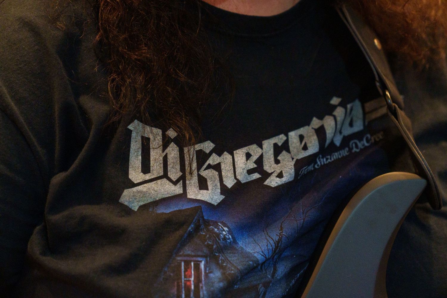Close-up of band logo and musical equipment during recording session.