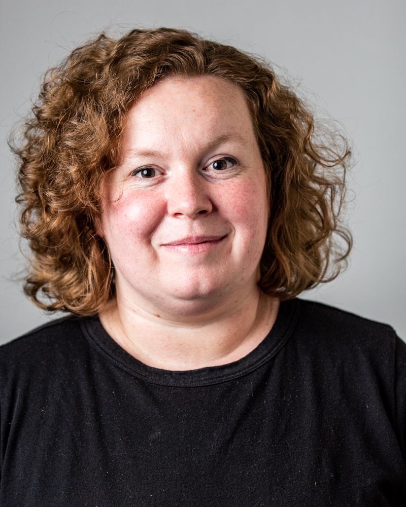 Professional headshot series with natural expressions against light gray background.