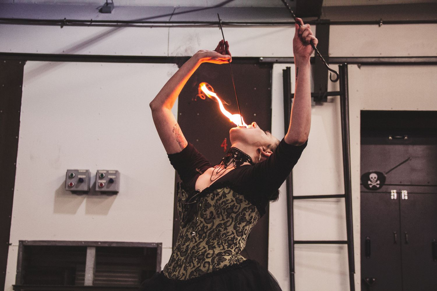 Performers engage in physical comedy and theatrical movements on stage.