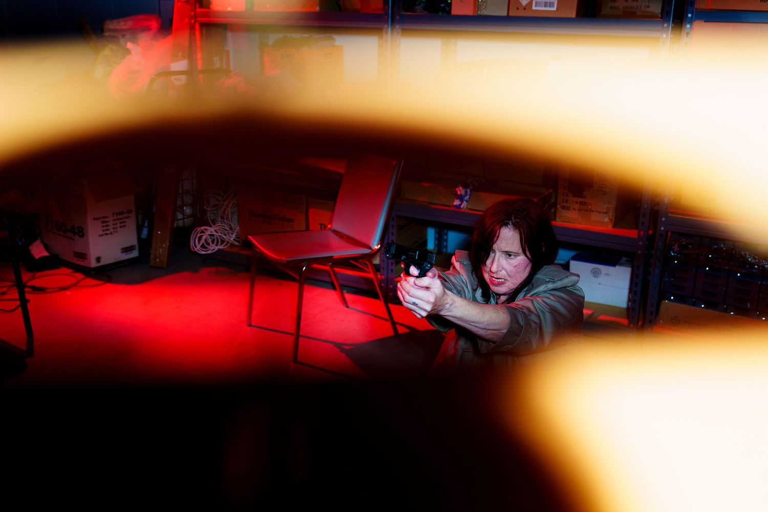 Cinematic shots with warm lighting and dramatic red tones in an indoor setting.