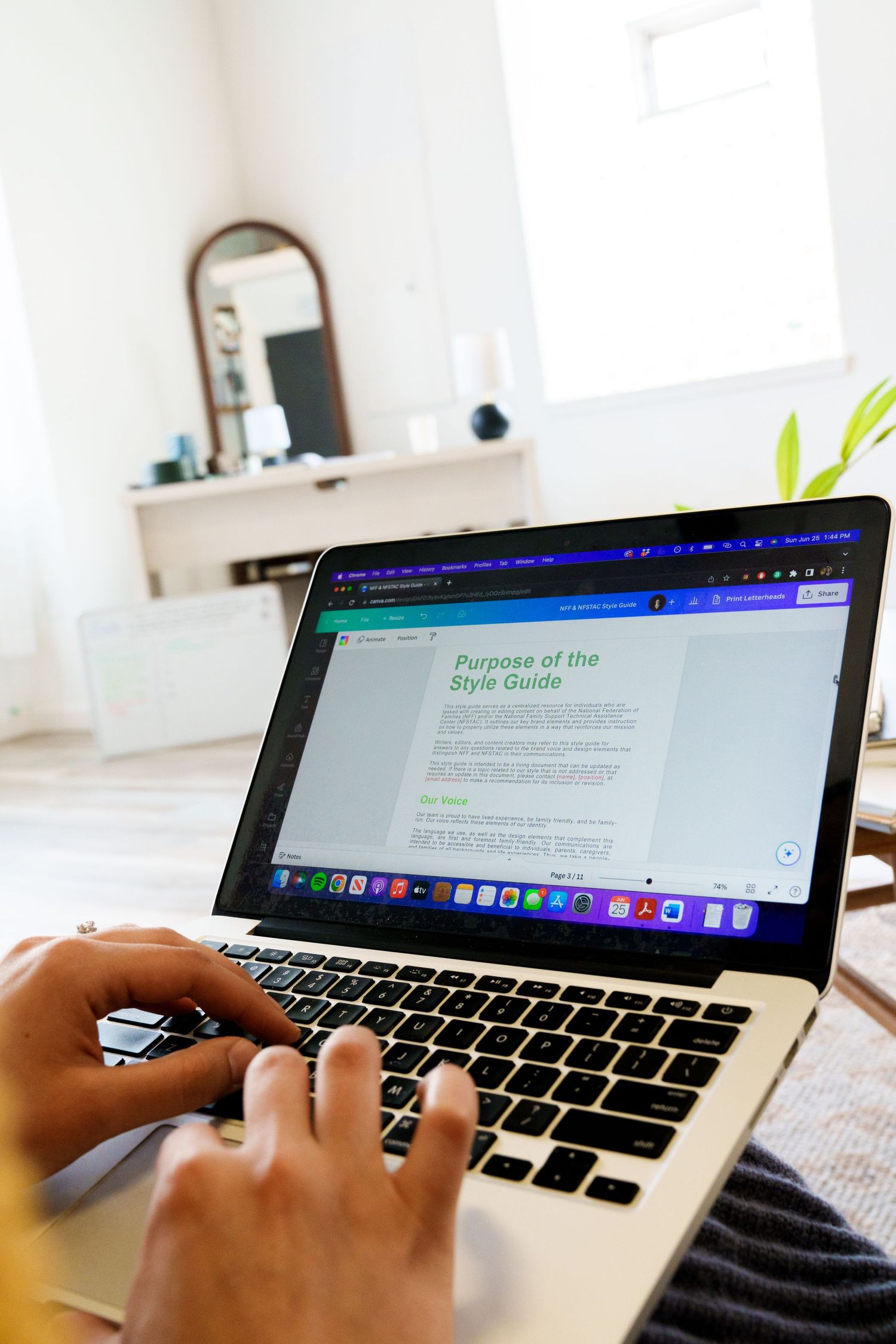 Laptop displaying style guide document in bright minimal workspace.