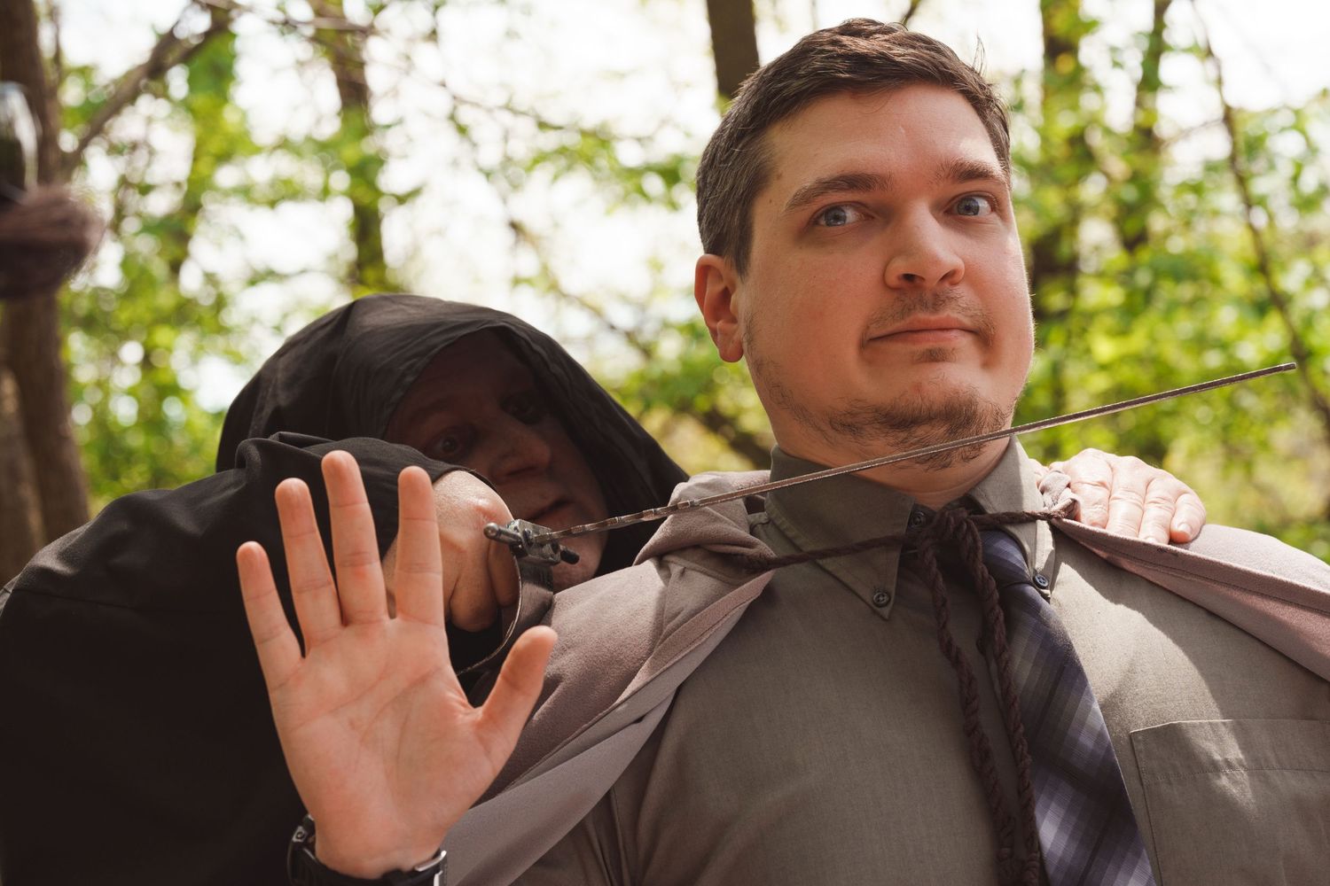 Film crew directing and coordinating scenes during an outdoor production shoot.