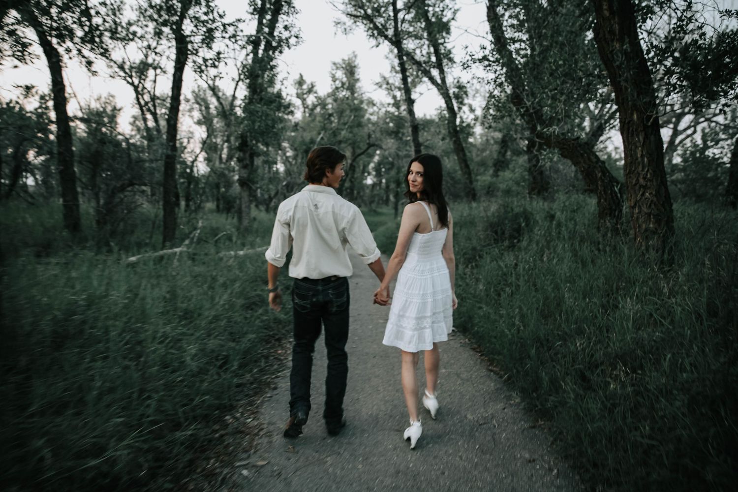 an engaged couple getting engagement photos in lethbridge alberta with engagement and wedding photographer allie cooke photography