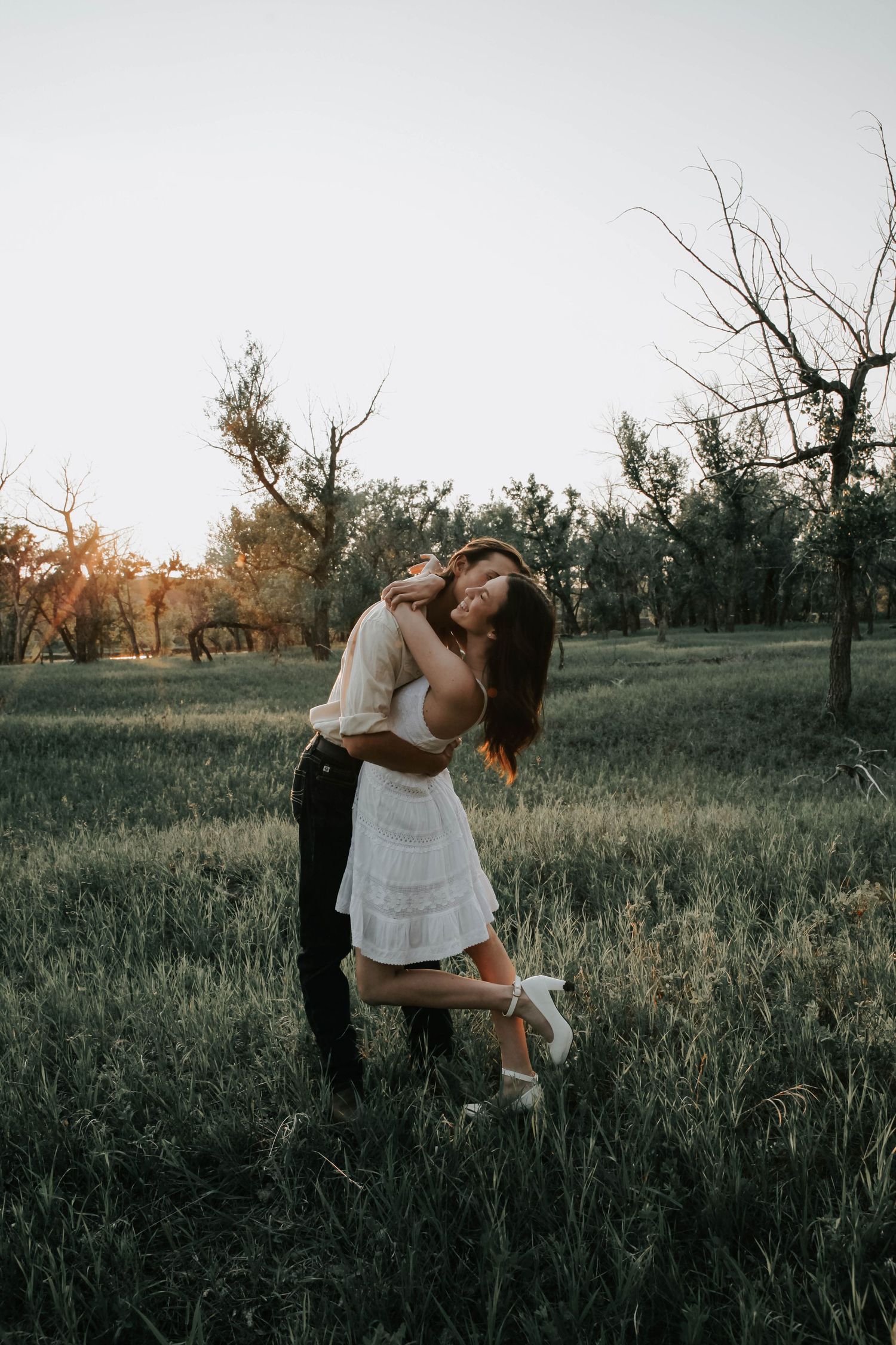 couples photographer taking engagement photos in lethbridge alberta with an engaged couple - complimentary engagement sessions with booking