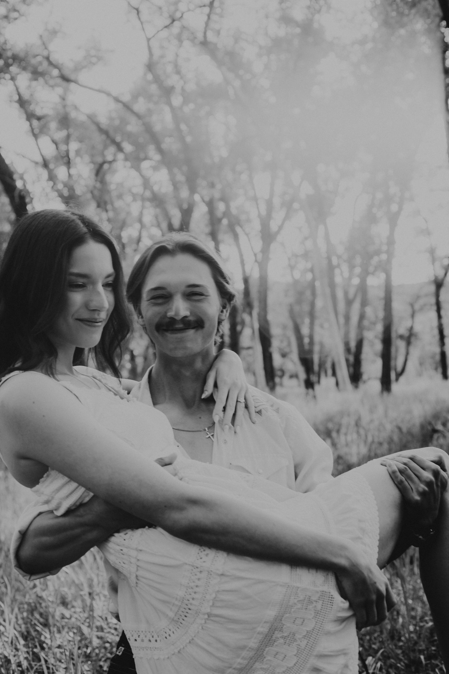 an engaged couple getting engagement photos in lethbridge alberta with engagement and wedding photographer allie cooke photography