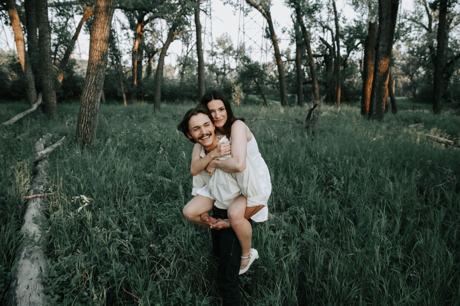 an engaged couple getting engagement photos in lethbridge alberta with engagement and wedding photographer allie cooke photography