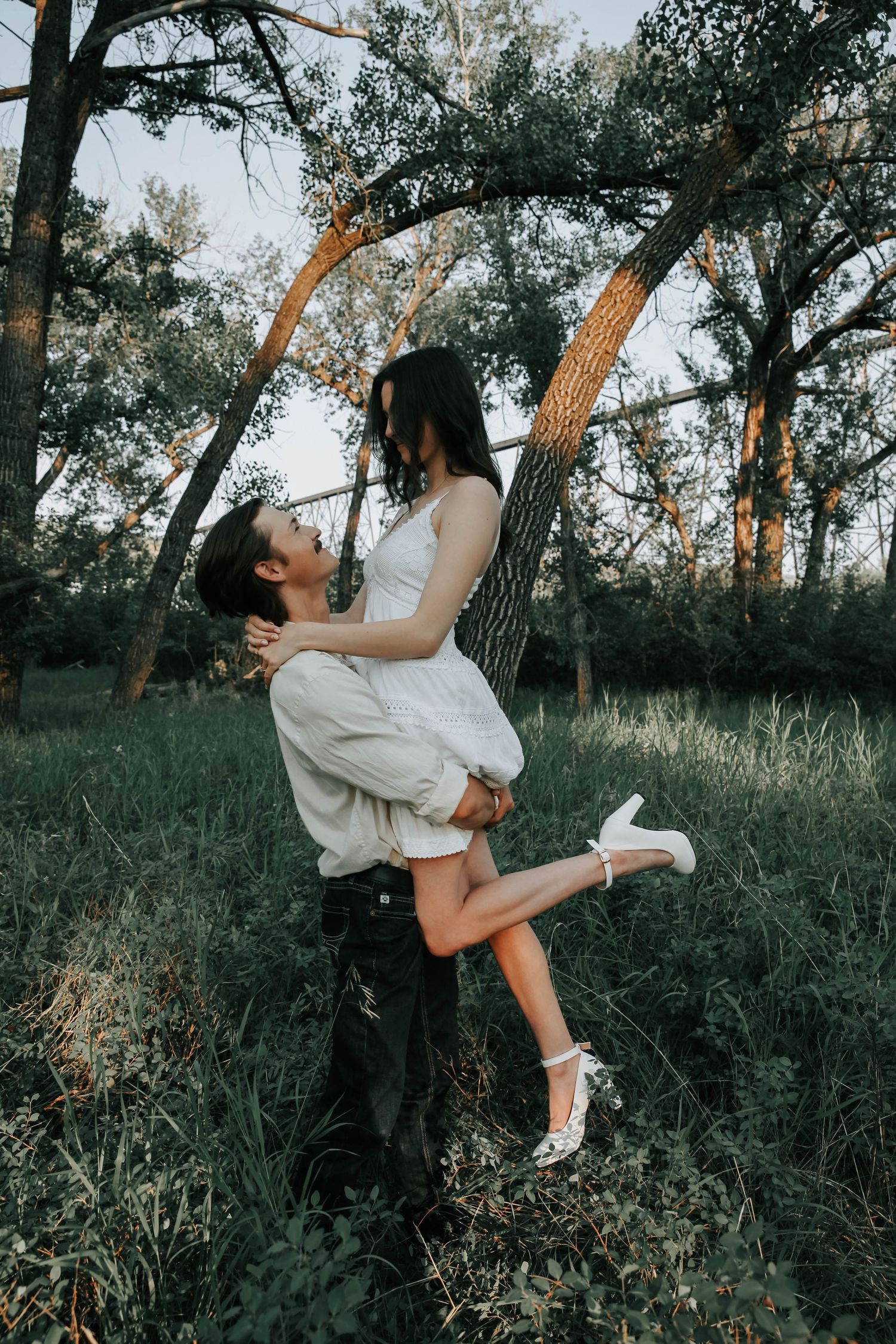 an engaged couple getting engagement photos in lethbridge alberta with engagement and wedding photographer allie cooke photography