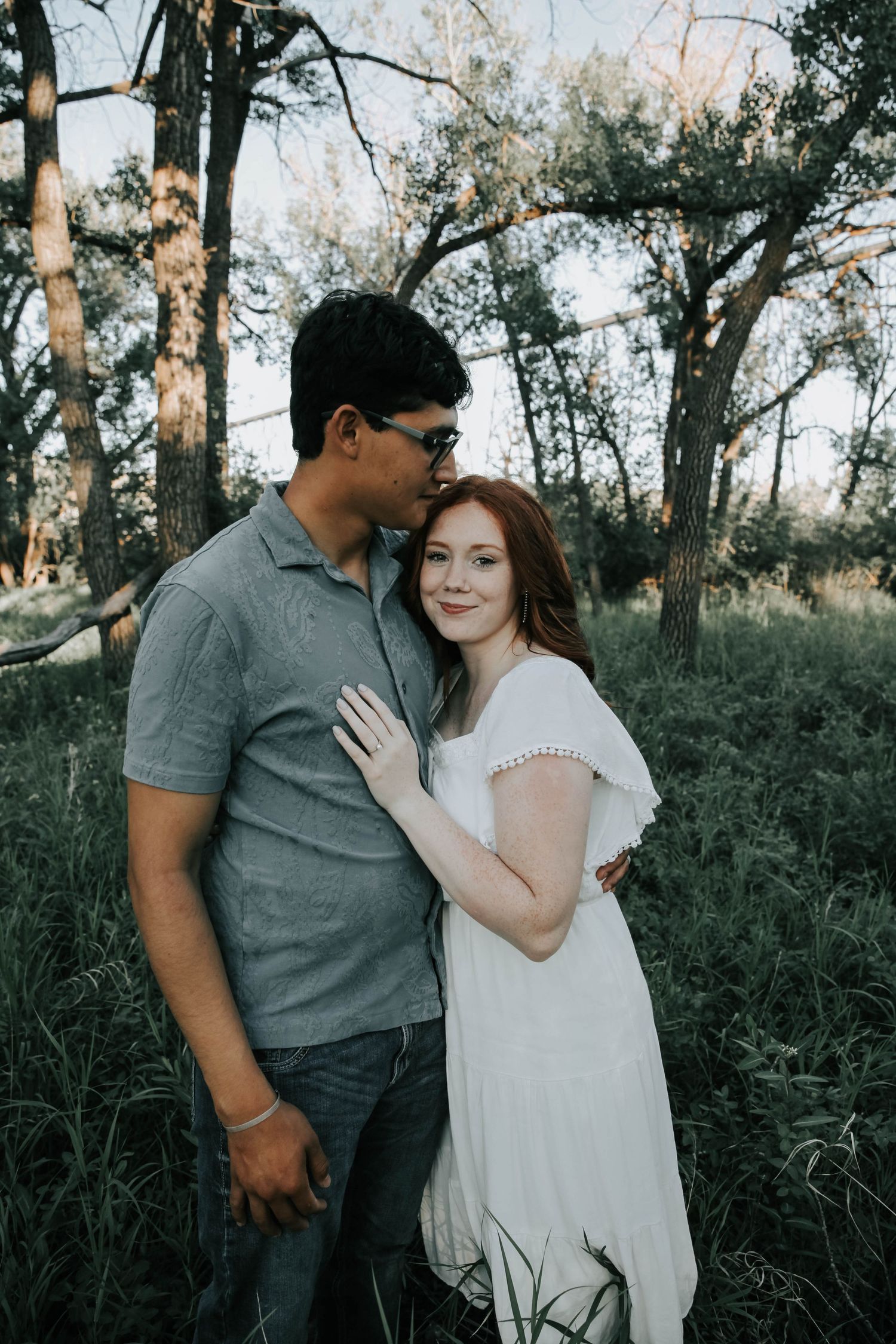 couples photographer taking engagement photos in lethbridge alberta with an engaged couple - complimentary engagement sessions with booking