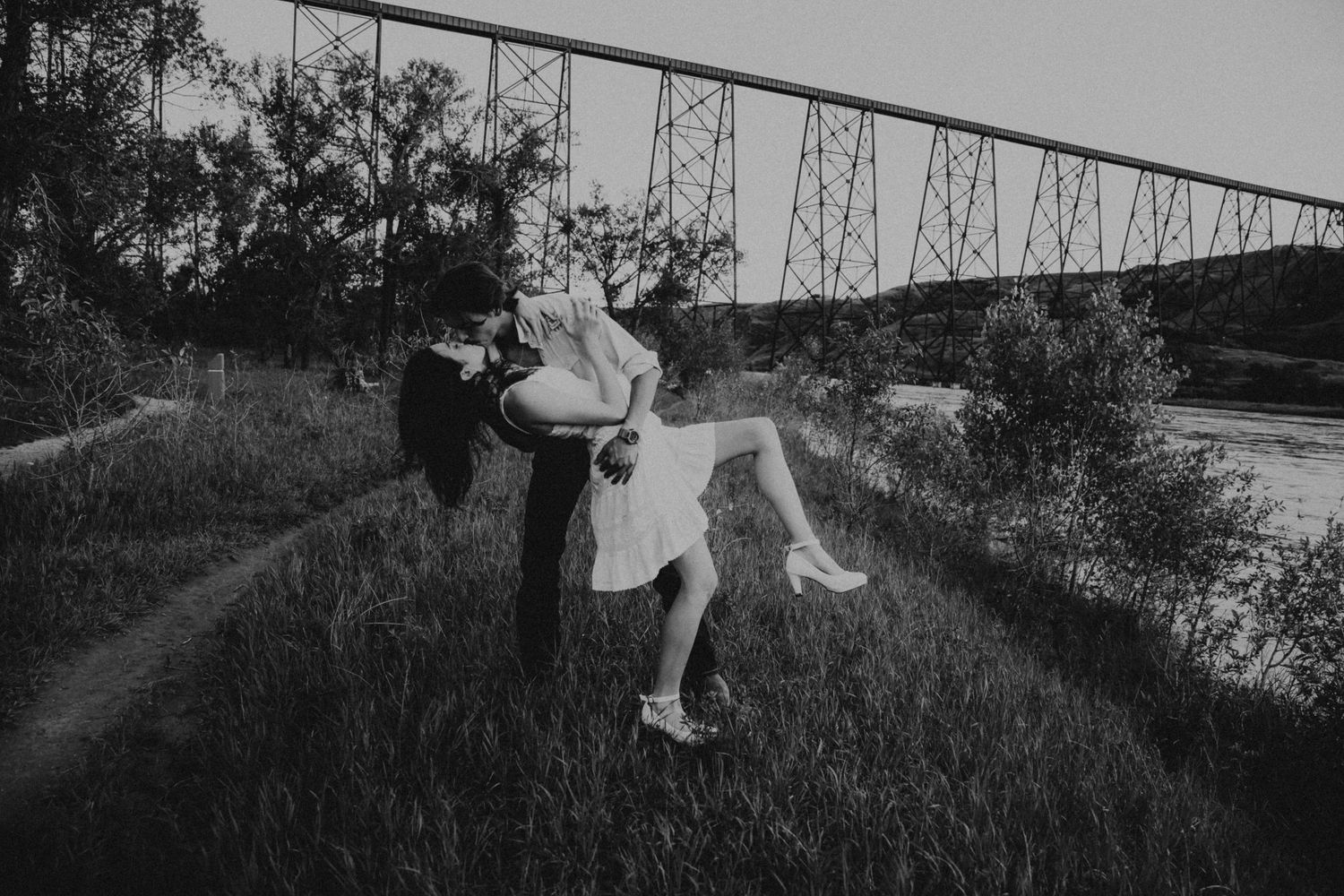 an engaged couple getting engagement photos in lethbridge alberta with engagement and wedding photographer allie cooke photography