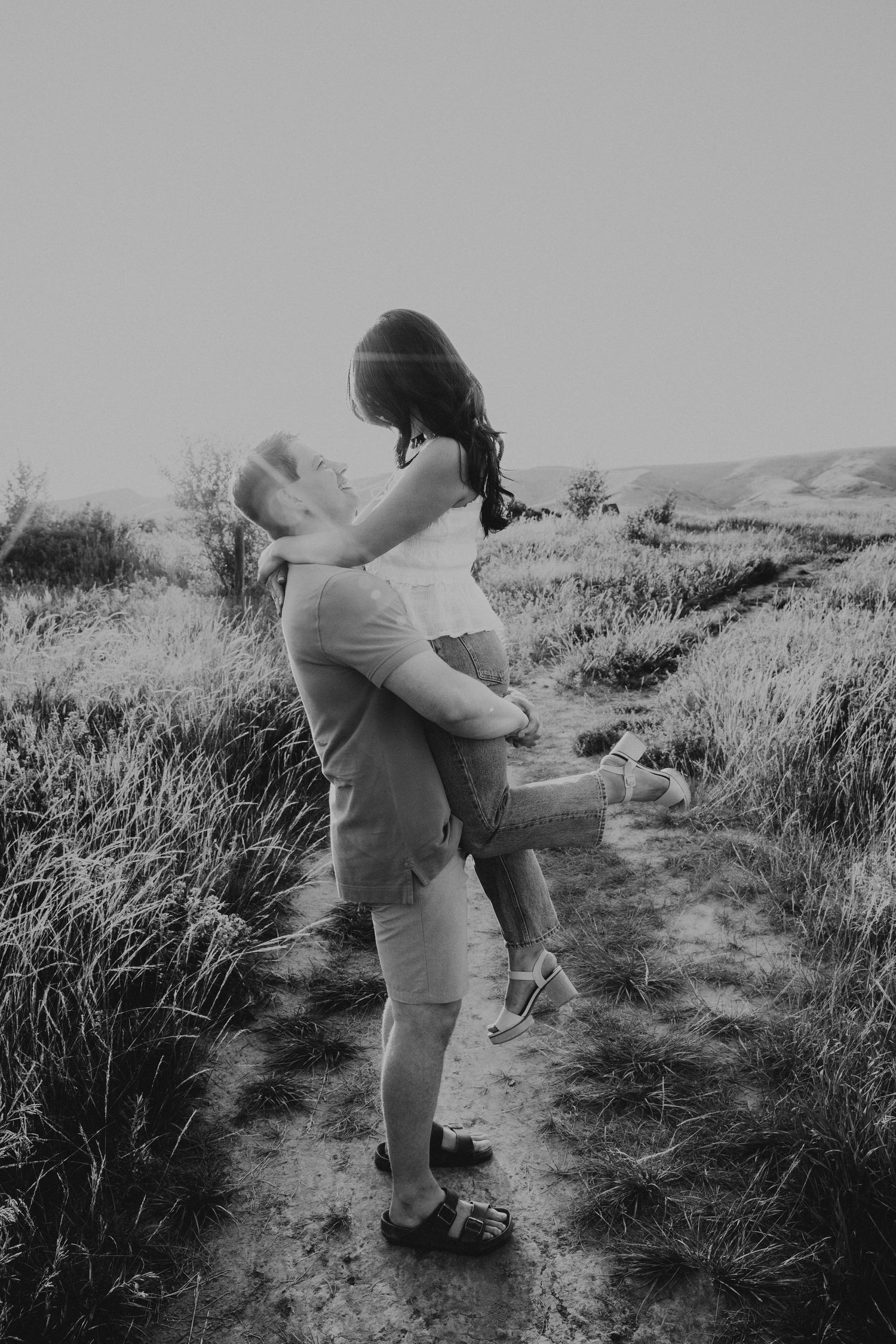wedding and engagement photographers in lethbridge alberta - couples engagement session shot in west lethbridge at popson park alberta