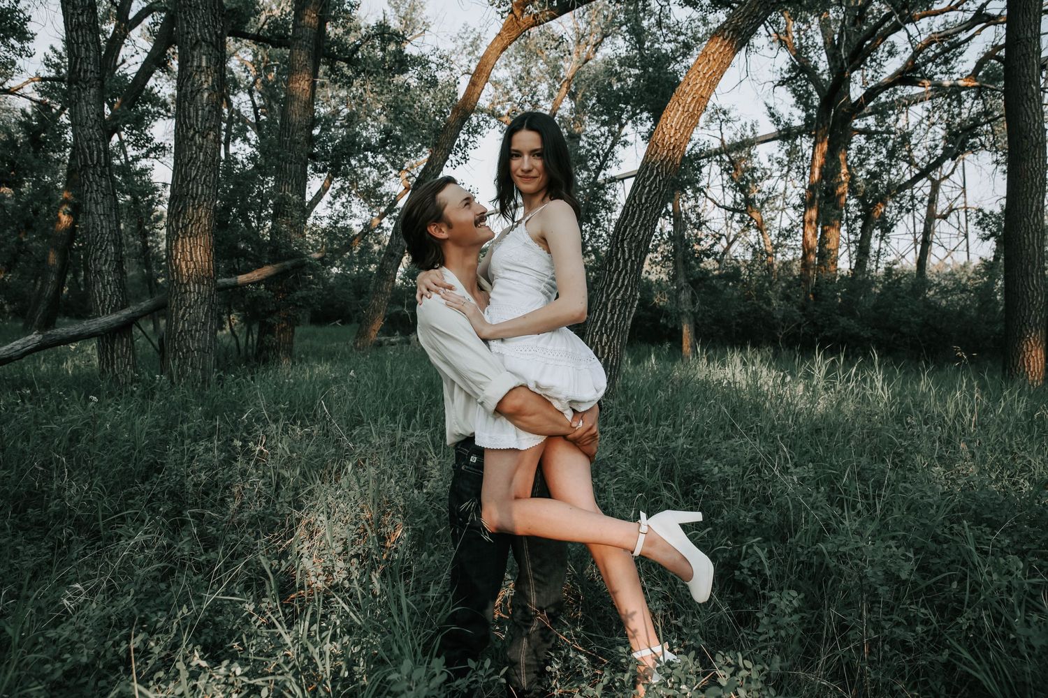 couples photographer taking engagement photos in lethbridge alberta with an engaged couple - complimentary engagement sessions with booking