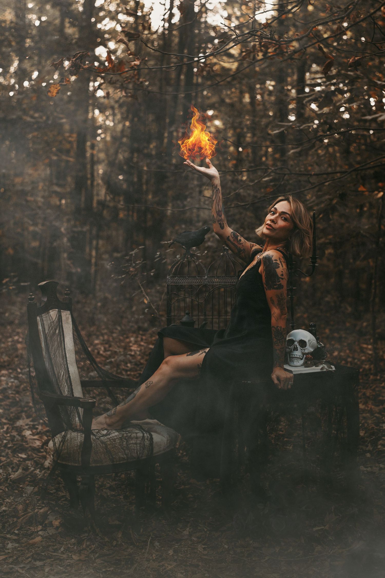 A dark and moody photo sequence showing someone in black clothing performing with fire in a misty forest setting.