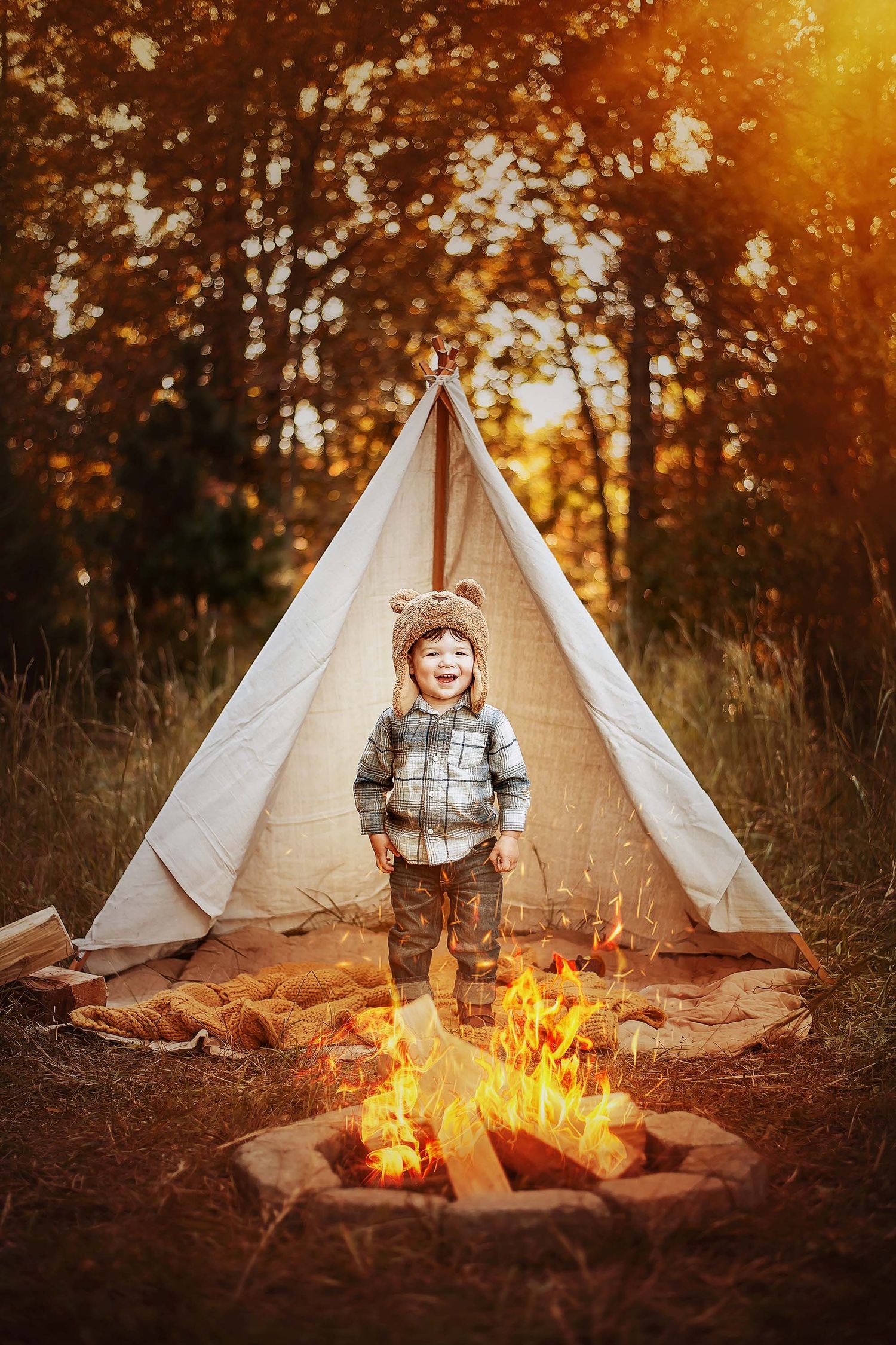 A teepee tent and campfire create a cozy autumn scene at sunset with golden light filtering through trees.