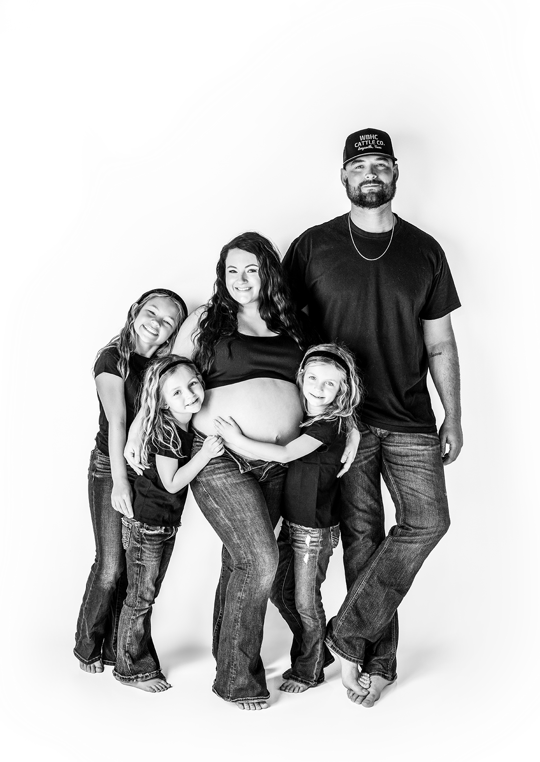 A black and white triptych photo series showing a casual family portrait sequence in matching jeans and t-shirts.