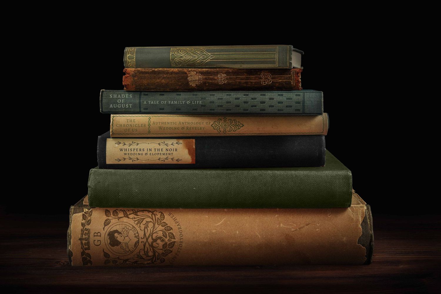 Stack of seven antique vintage hardcover books piled on wooden surface against dark background.