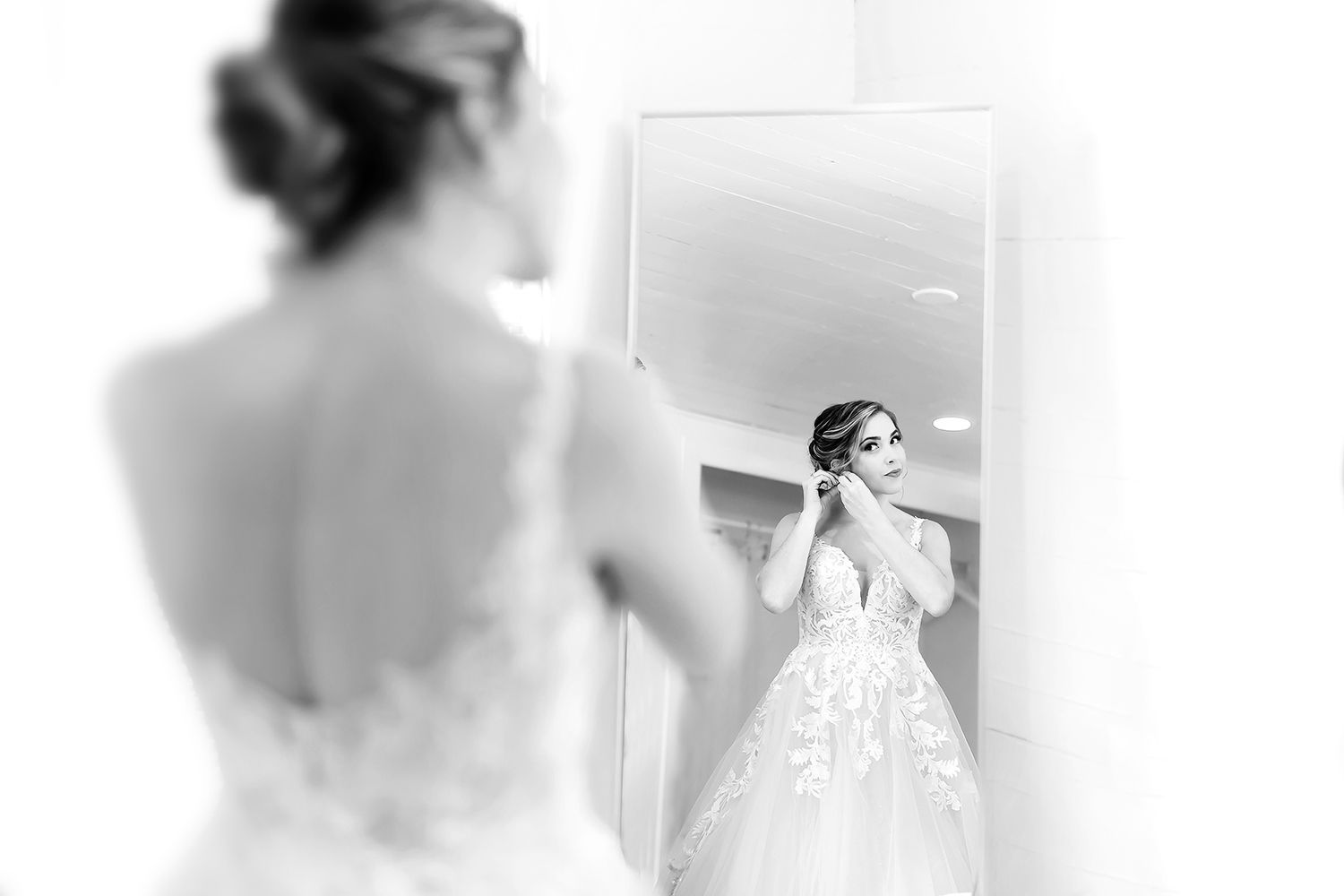 A black and white collage of bridal preparation moments showing details of a wedding dress and getting ready.