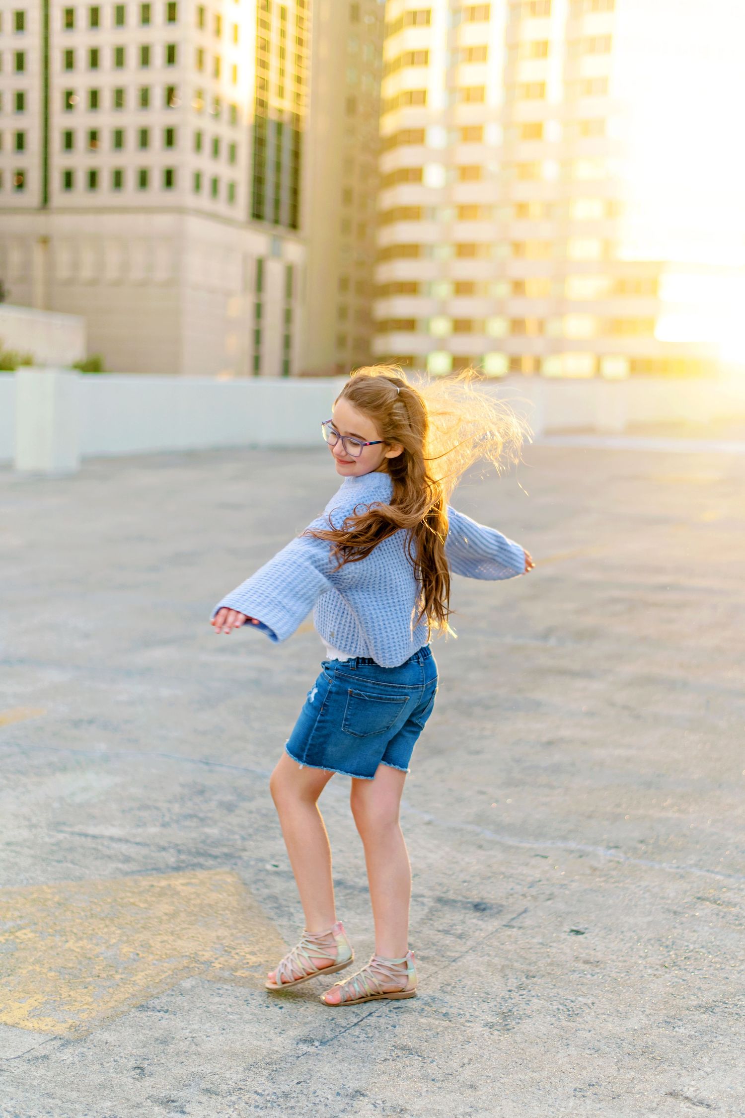 Golden hour urban rooftop scene with movement and joy.