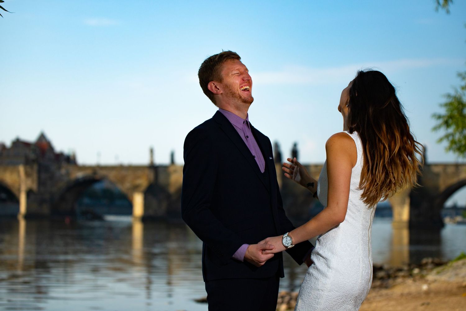 A couple enjoying their engagement photo session taken in Prague, Czech Republic.