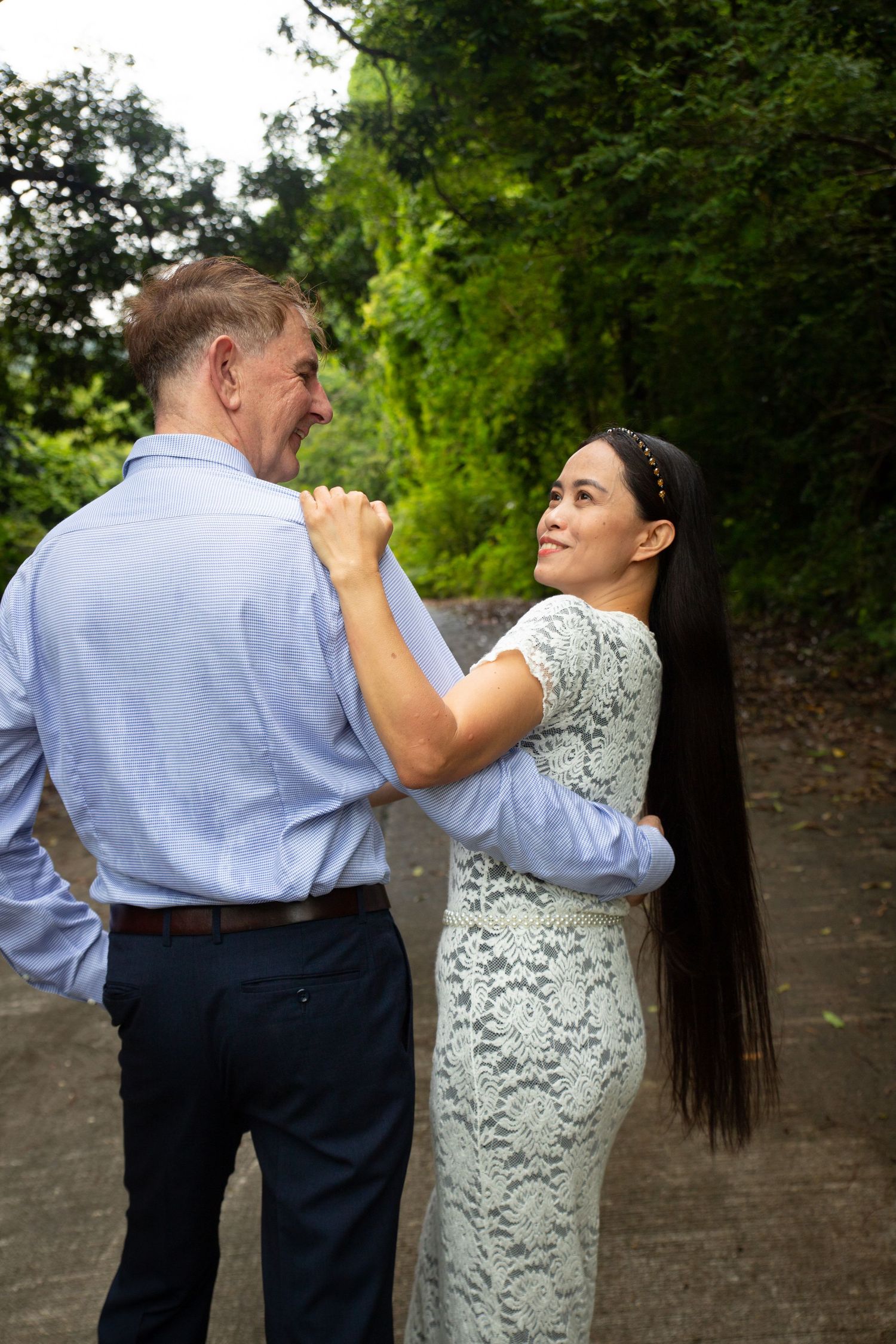 A couple enjoying their engagement photo session taken in the forests of Koh Samui, Thailand.