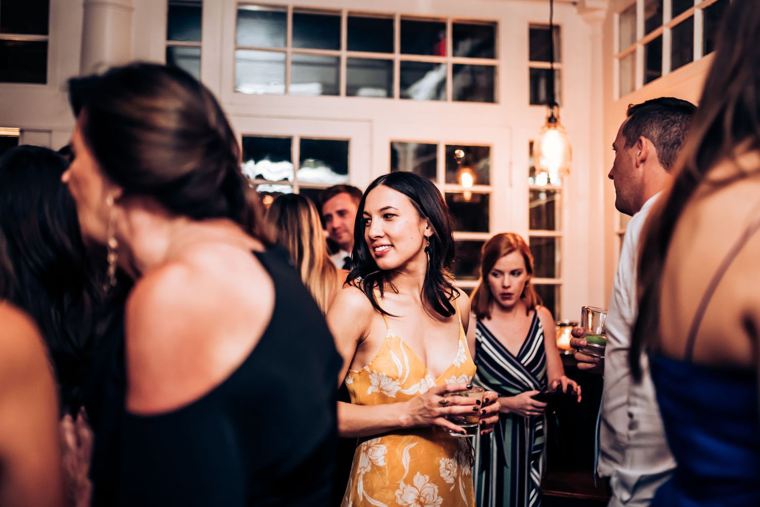 Guests mingle and socialize at an evening cocktail reception.