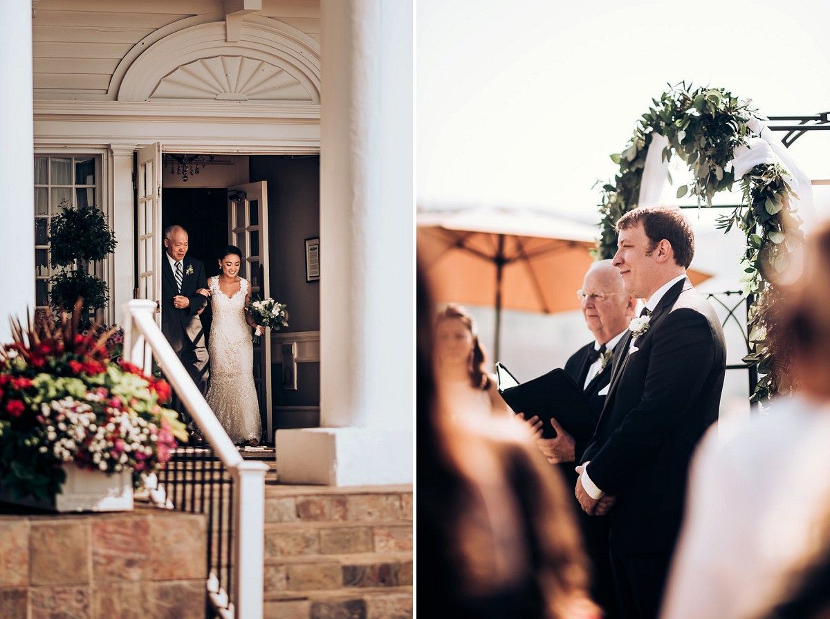Wedding ceremony at elegant colonial mansion with grand entrance and floral decorations.