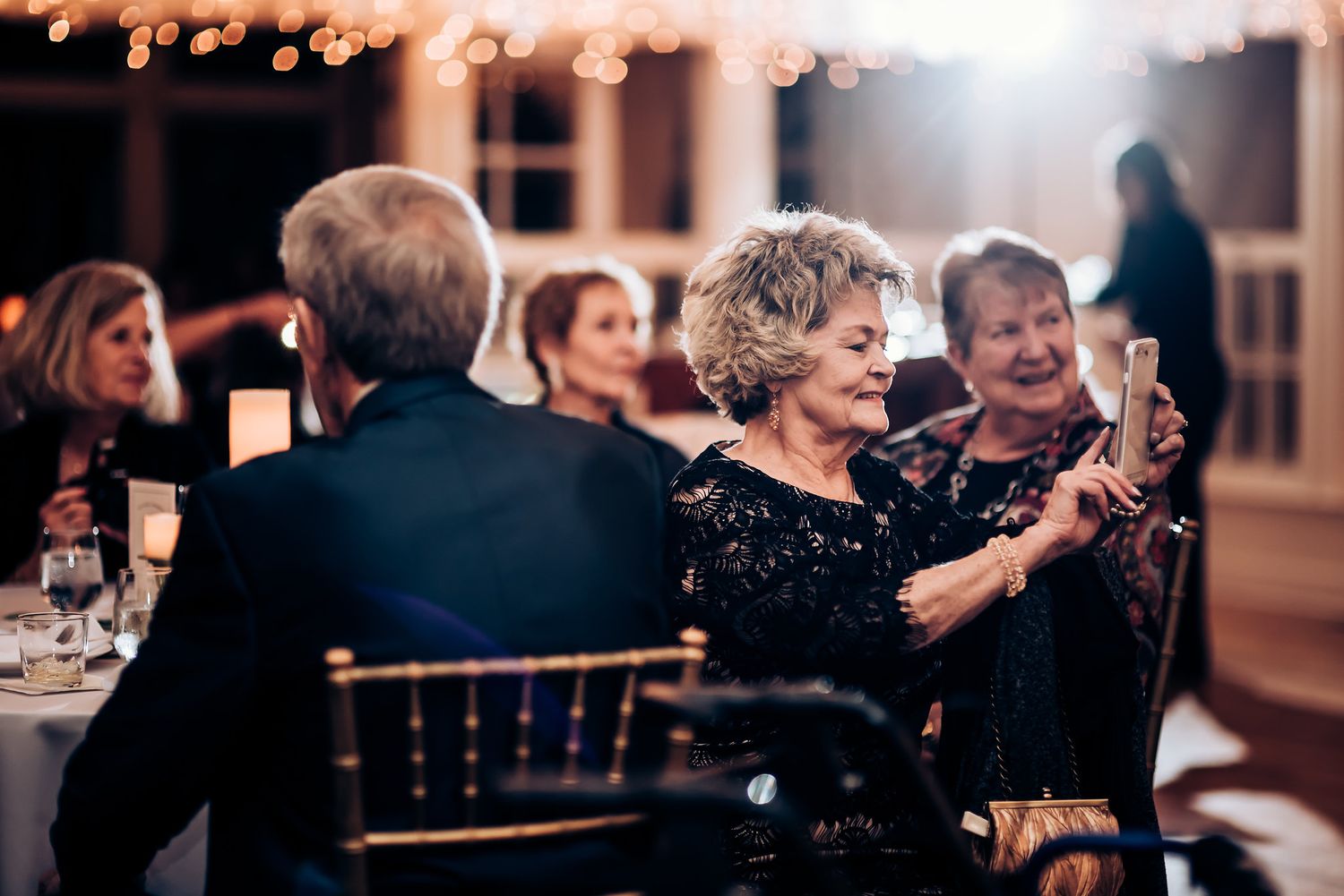 Guest enjoying a lively moment at an elegant evening reception.