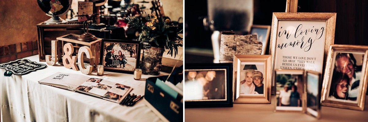 Vintage suitcase display with framed photos and wedding memorabilia on wooden table.