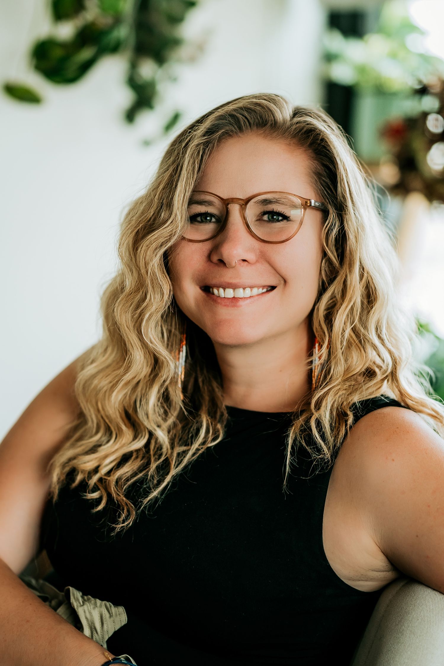 Professional headshot session in natural light with bright white background.