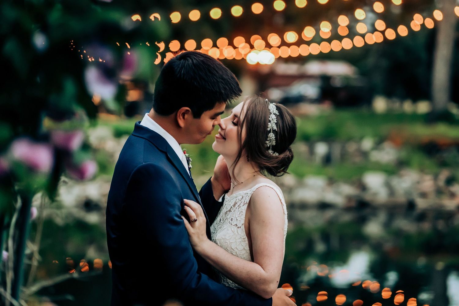 String lights create a romantic ambiance during an evening outdoor celebration.
