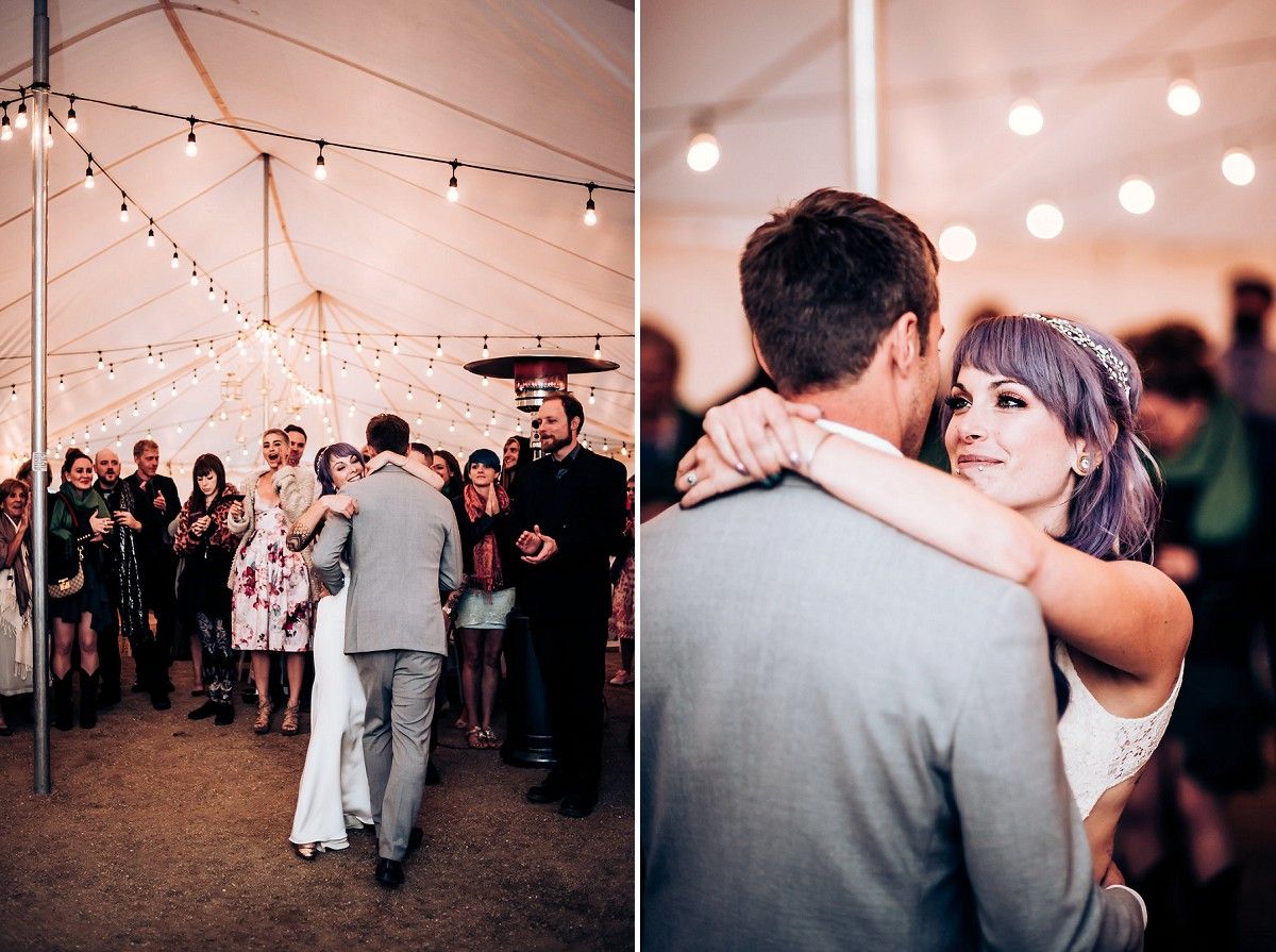 Couples dancing together during wedding reception under string lights.