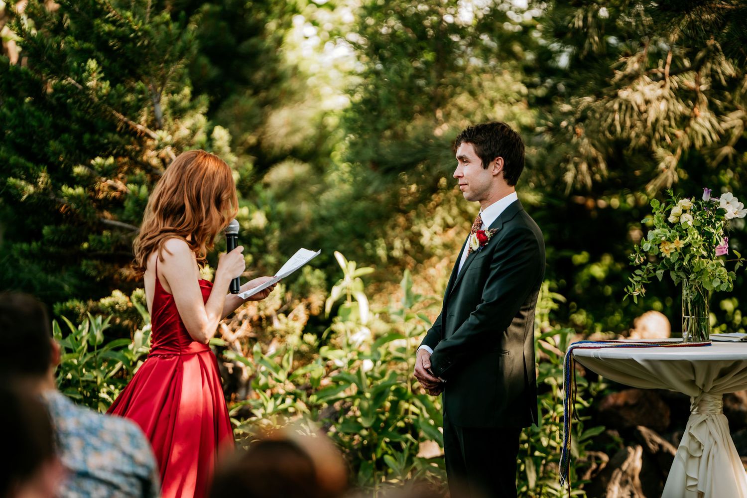Exchange of vows during an intimate garden wedding ceremony.