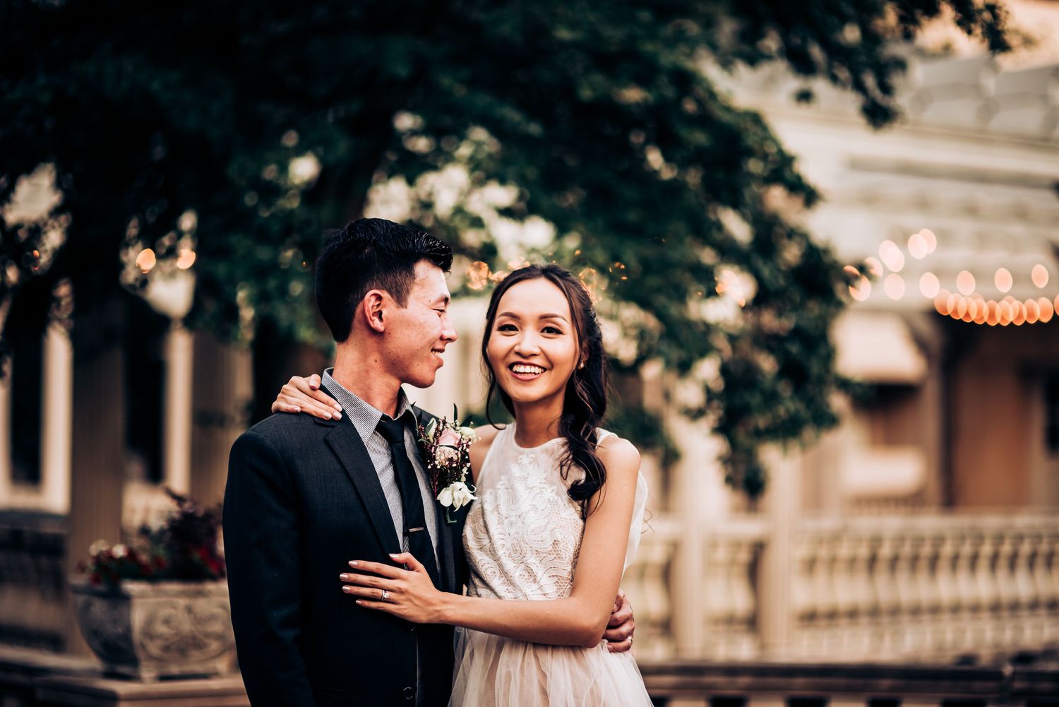 Wedding portrait on architectural grounds with classic building in background.