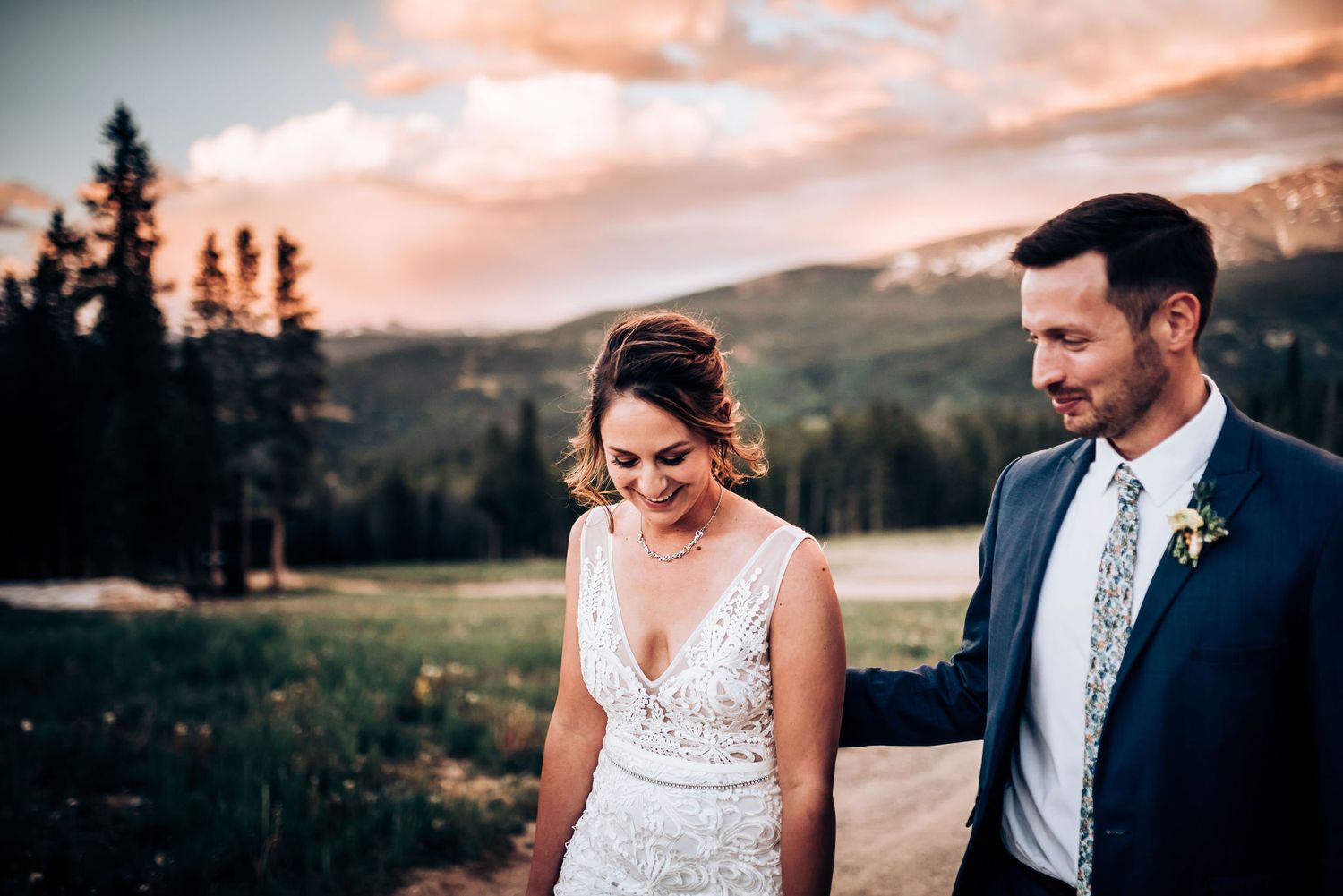 A joyful celebration against mountain backdrop at sunset.