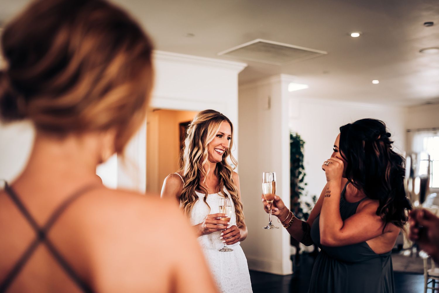 Wedding celebration scene with champagne glasses and festive atmosphere.