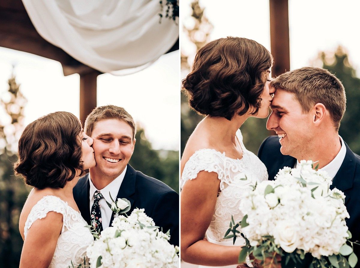 Tender wedding moments captured under decorative white draped pavilion with white bouquet.
