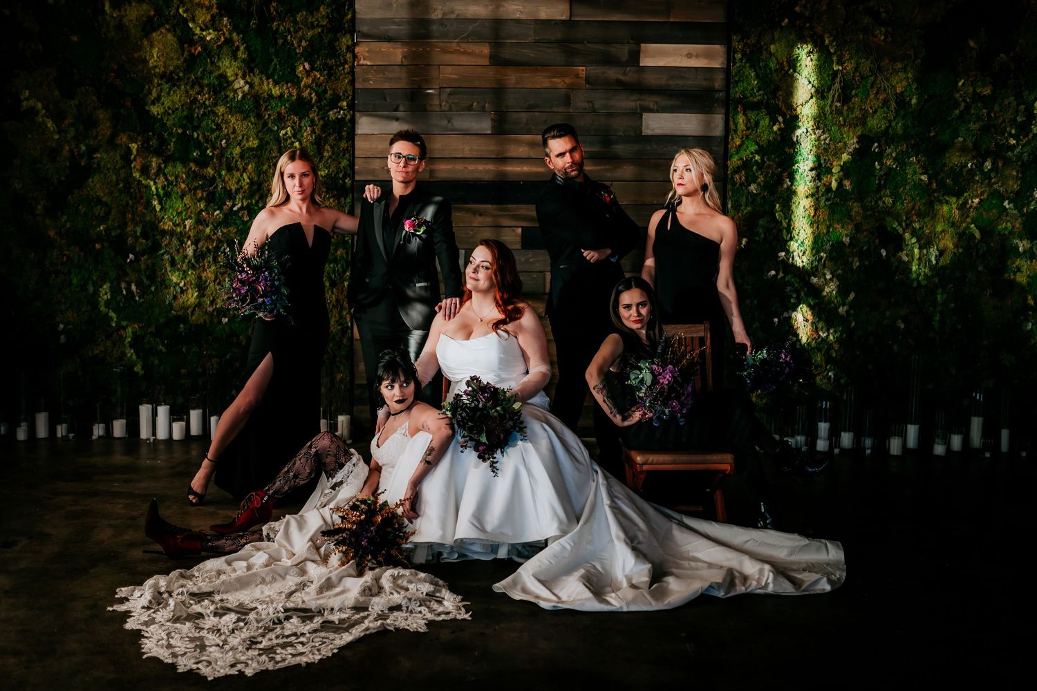 Wedding photography session in a dramatic garden setting with evening lighting.