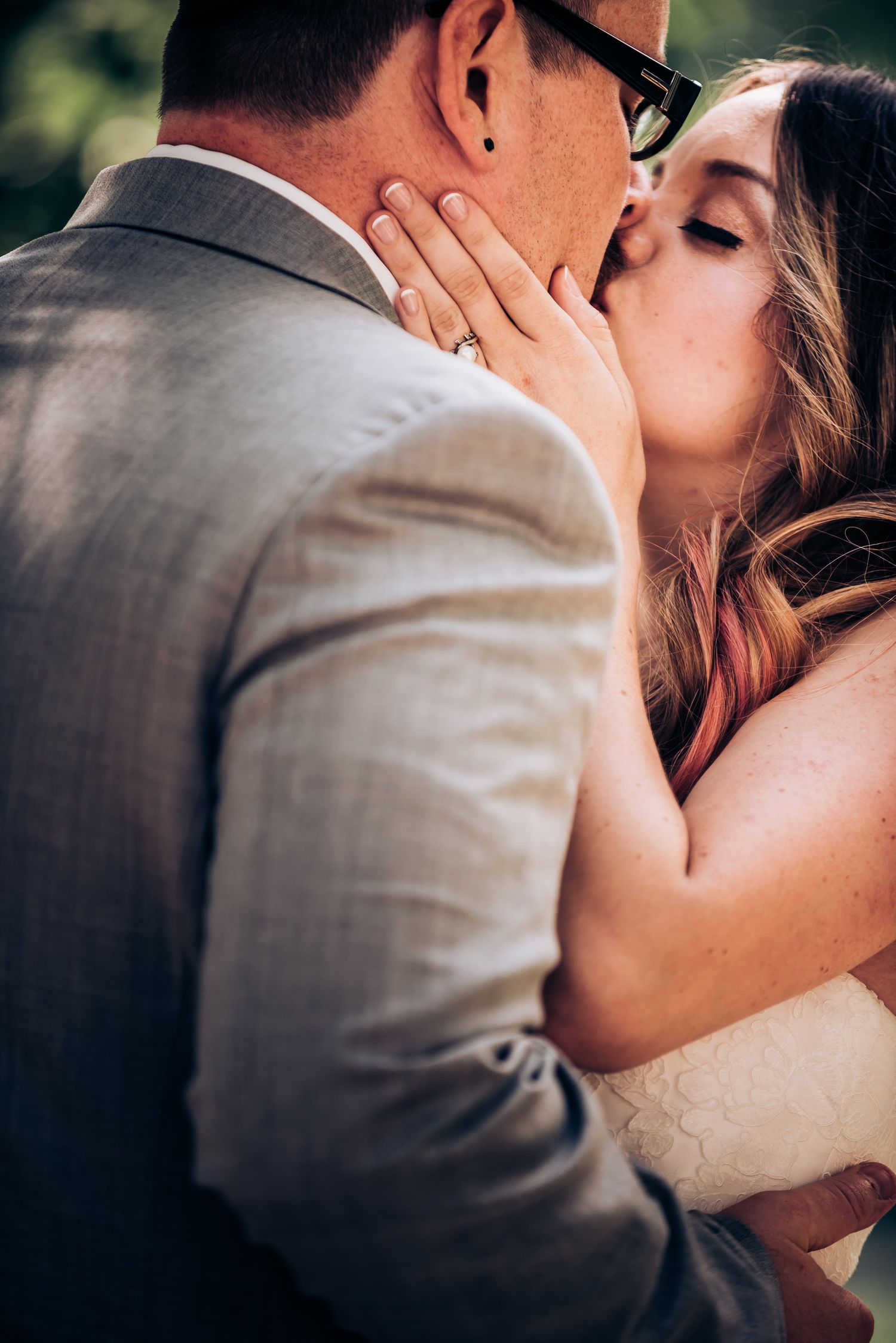 An intimate wedding moment captured during an outdoor ceremony.