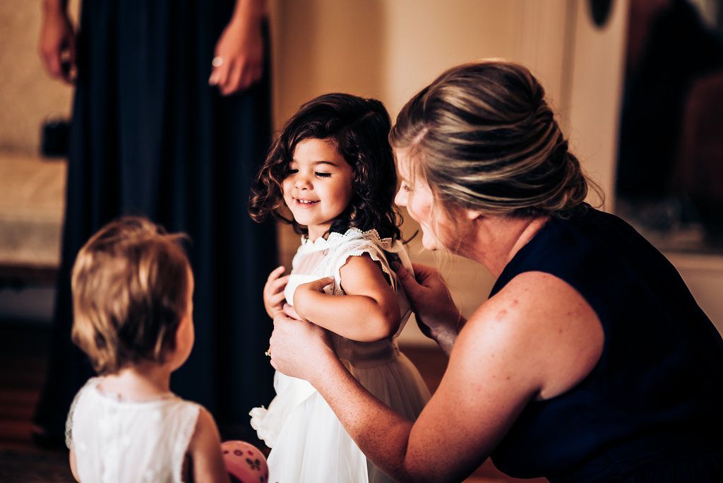 A tender moment shared with a baby at a formal gathering.