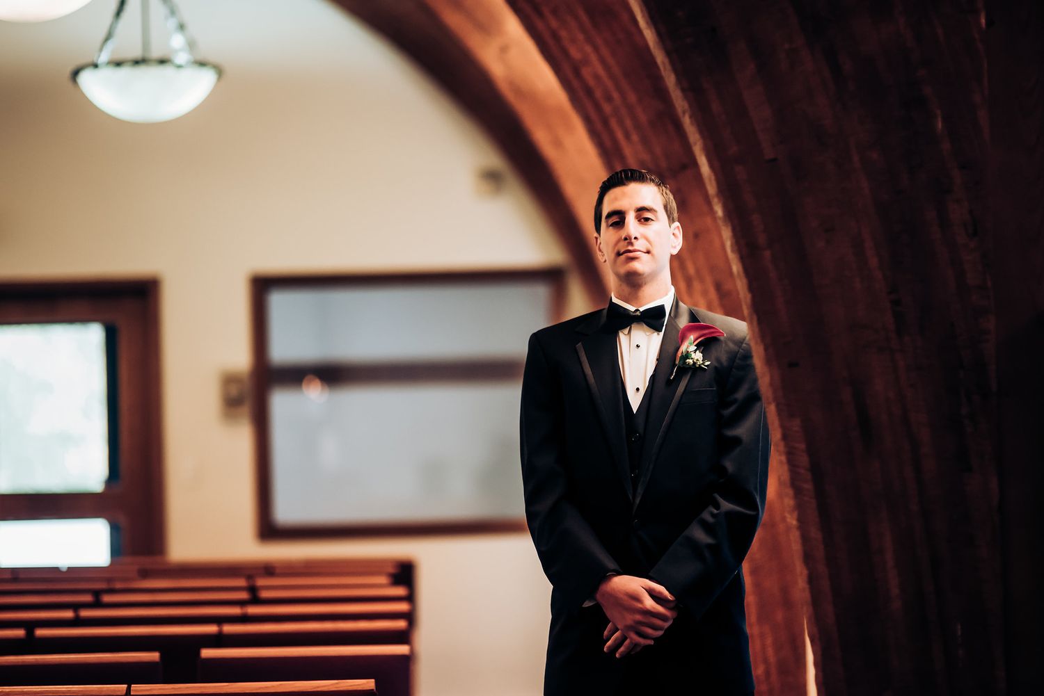 An elegant chapel setting with wooden arches and classic architecture.