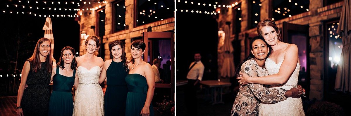 Attendees in formal attire posing and celebrating at an indoor venue with string lights.
