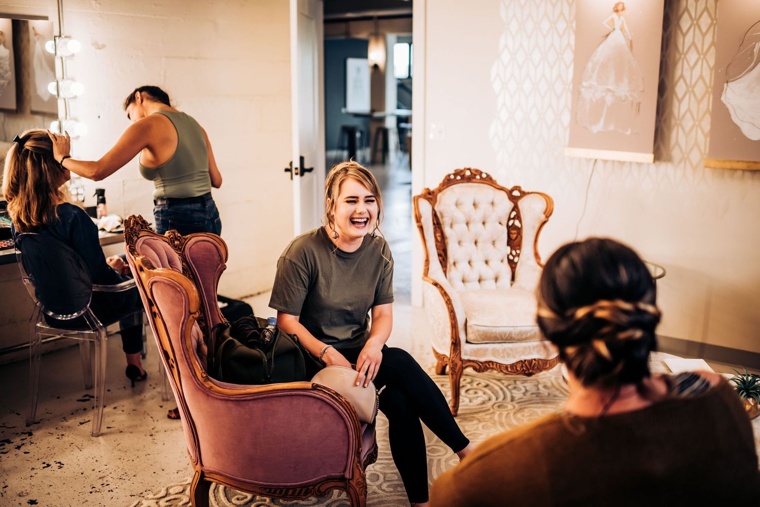 Hair and makeup preparation session in a vintage-styled salon interior.