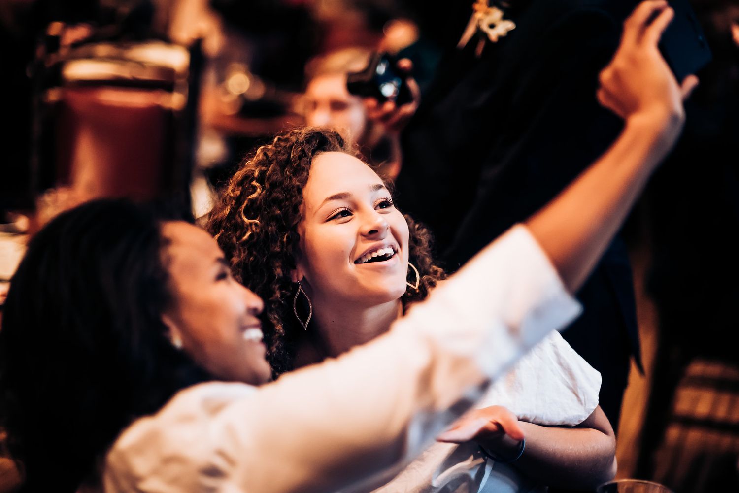Joyful celebration scene at an evening party with dancing.