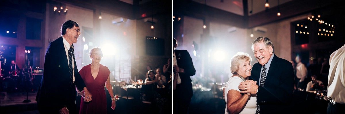 Atmospheric reception scene with dramatic lighting and dancing guests.