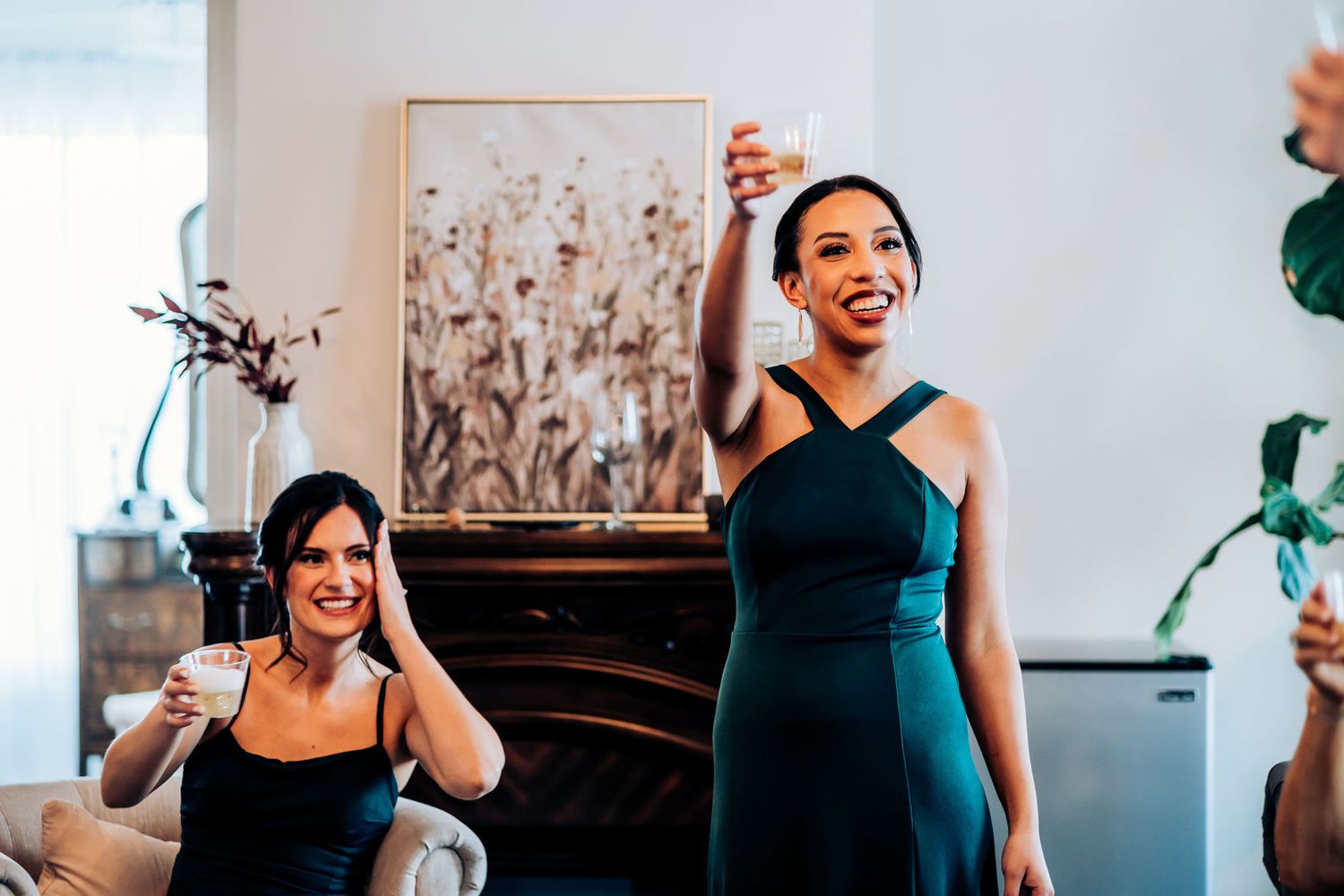 Two people wearing formal attire share a joyful moment during a celebration event.