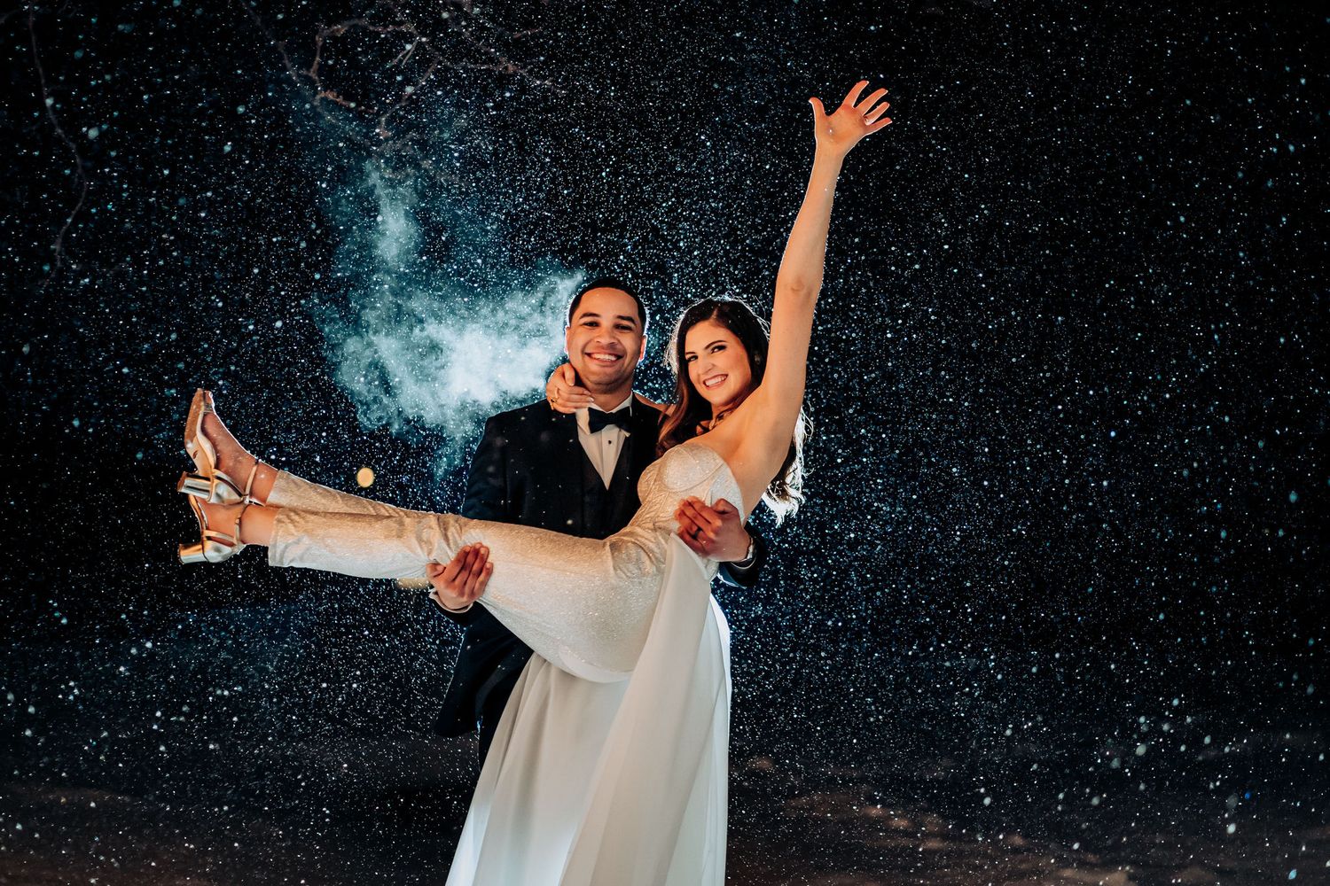 Joyful dancing pose captured against a snowy starlit background.