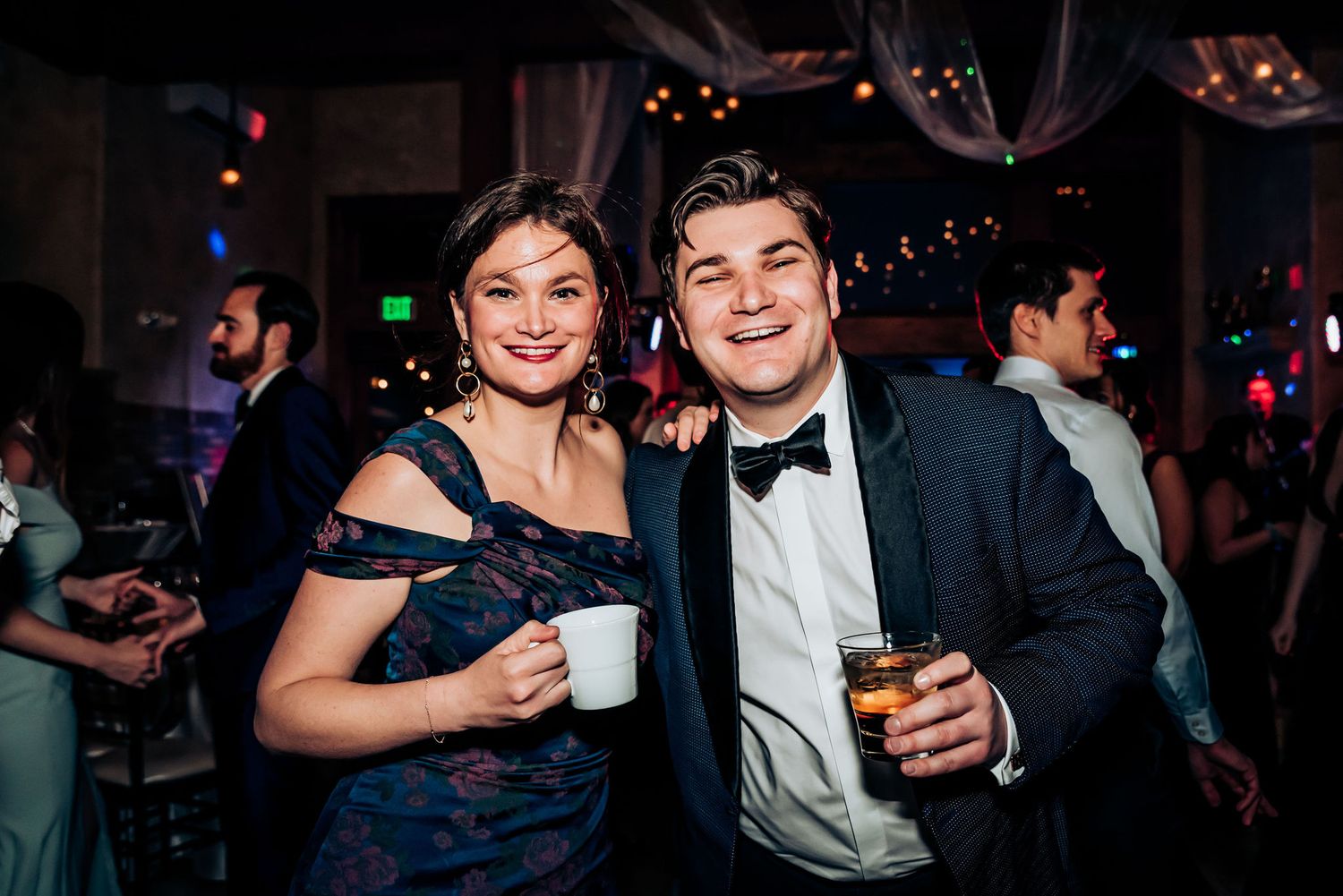 Guests enjoying drinks and conversation at an elegant evening celebration.